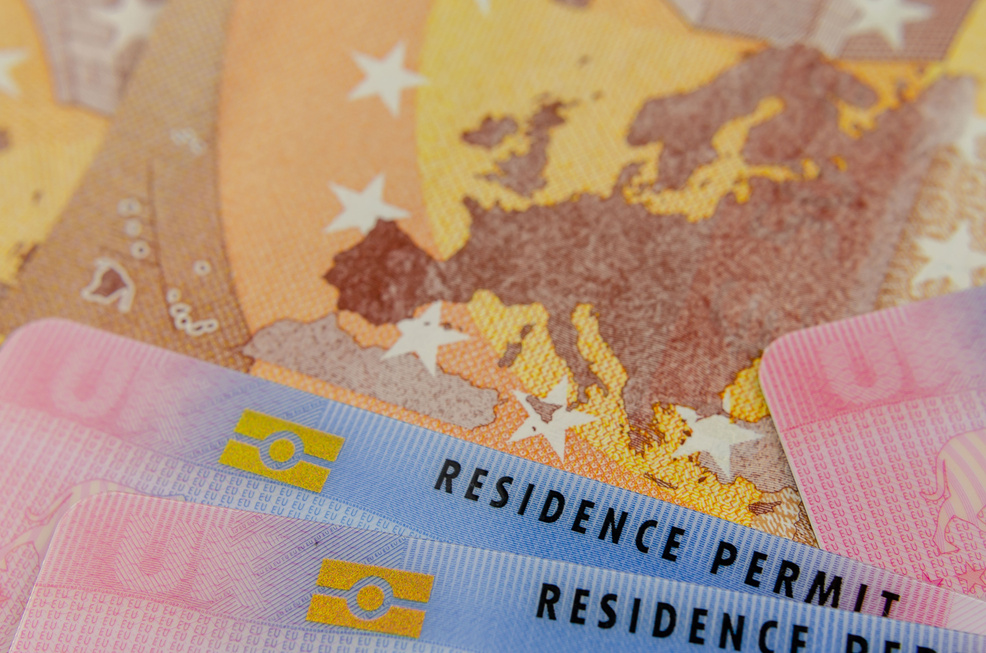 UK Biometrical Residence Permit (BRP) cards and a map of the EU on the Euro banknote.